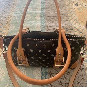Dooney and Bourke traditional logo all over purse with bonus wristlet.